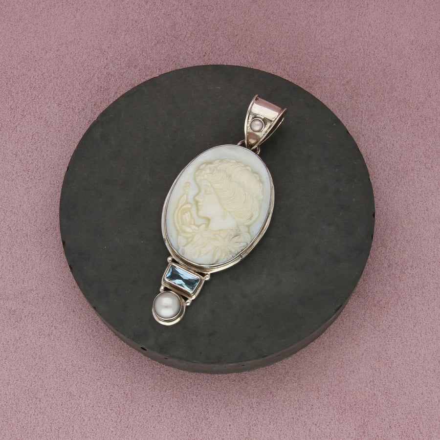 sterling silver topaz & carved mother of pearl silhouette pendant