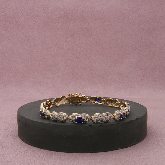 sterling silver gold plate sapphire x tennis bracelet size 7.5in